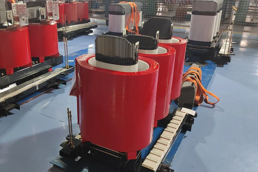 Close up view of cast resin dry type transformer windings, epoxy resin insulation, copper conductors, coil assembly, and advanced electrical insulation components during precision transformer manufacturing at Yawei Transformer.