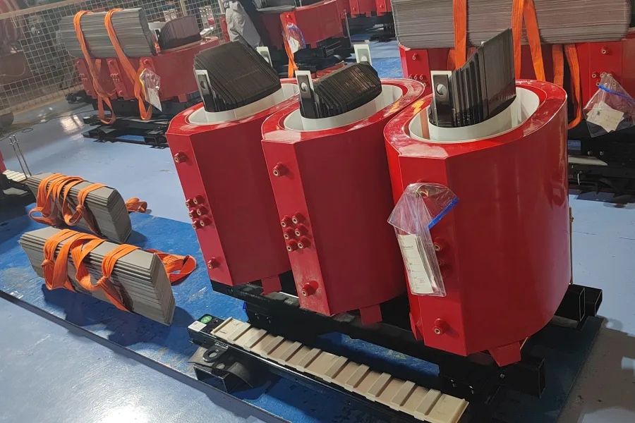 Precision manufactured cast resin dry type transformer windings with high performance epoxy insulation, copper coil conductors, advanced winding construction, and reliable electrical insulation for medium voltage power distribution systems by Yawei Transformer.